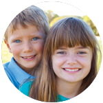 A young boy and girl smiling.